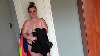 fat girl playing dress up by trying on different dresses