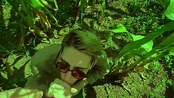 a guy helps his friend in the cornfield