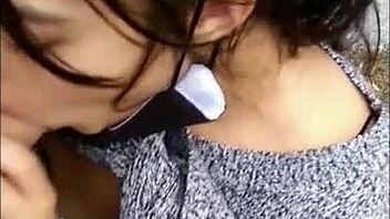 Risky public blowjob on the street, flashing tits for voyeurs.