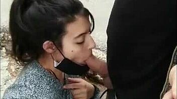 Risky public blowjob on the street, flashing tits for voyeurs.