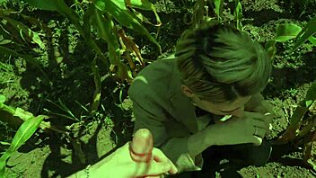 a guy helps his friend in the cornfield