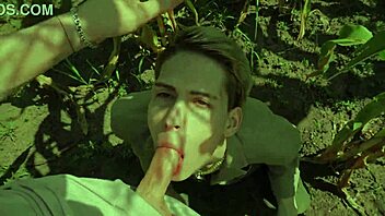 a guy helps his friend in the cornfield