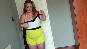 fat girl playing dress up by trying on different dresses