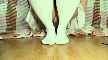 Beautiful Legs With Red Nails In Close-Up