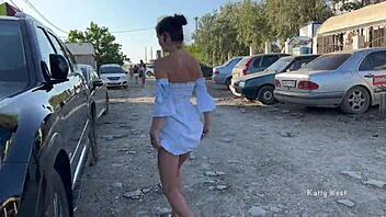 Two young women go topless and expose their private parts in a public place