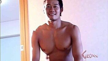 Gay Asian bodybuilder shows off his muscles