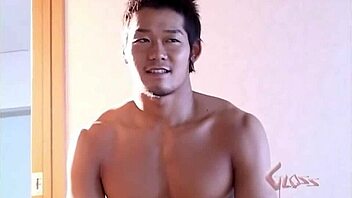Gay Asian bodybuilder shows off his muscles