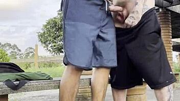 Hardcore outdoor pounding in public square with daring young guys ignoring passersby.