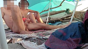 Public beach masturbation ends with a cum shower for all