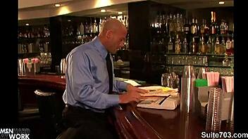 Long-haired gay guy blows bald man at work.