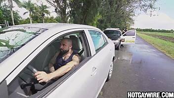 Surprised cop pulled over by muscular gay bodybuilder