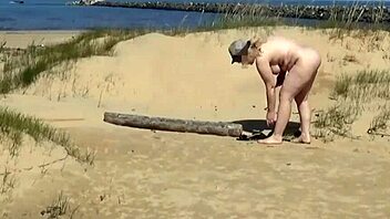 Anal toy action on the beach with a blonde bombshell