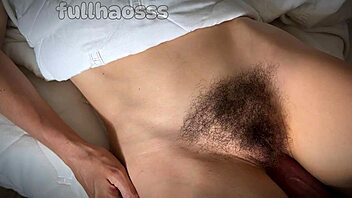 Close up of a big cock rubbing against a wet hairy pussy and cum on face
