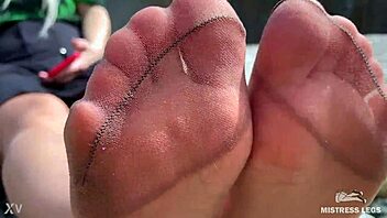 Cute MILF in tan nylons teases on the riverbank
