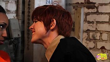 Raunchy lesbian prison guard teases redheaded prisoner.
