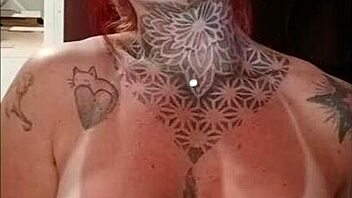 Redhead's Tan Lines and Big Tits in Sensual Display