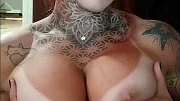 Redhead's Tan Lines and Big Tits in Sensual Display