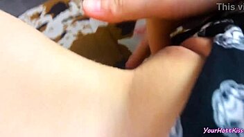 Beauty caresses herself watching porn in cute pajamas