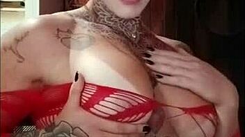 Redhead's Tan Lines and Big Tits in Sensual Display