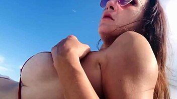 Italian MILF Artemisia shows off her big boobs in bikini