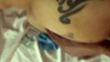 blonde with tattoo bends over in suggestive doggystyle pose