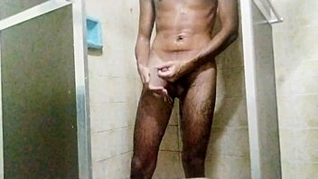 Taking a shower and masturbating to orgasm in the bathroom.
