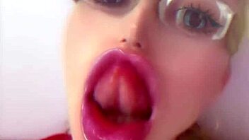 Bimbo doll transformation with huge pink lips and glasses
