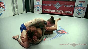 Daisy Ducati and Ruckus engage in hardcore wrestling