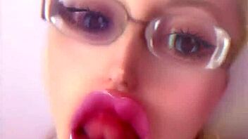 Bimbo doll transformation with huge pink lips and glasses