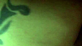 blonde with tattoo bends over in suggestive doggystyle pose