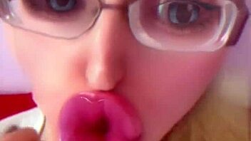 Bimbo doll transformation with huge pink lips and glasses