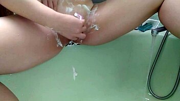 this sexy milf shaves her nice pussy in the shower, close up view 😍