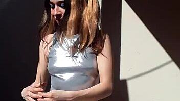 Bonneyuwu showcases her beautiful body in costumes while showing cards outdoors.