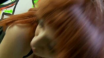 hot red milf encounters a big cock through the glory hole and gets fucked hard by it