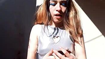 Bonneyuwu showcases her beautiful body in costumes while showing cards outdoors.