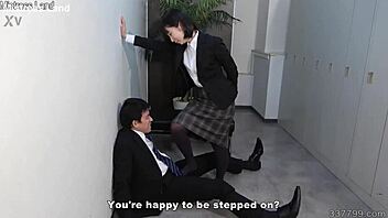 A petite Japanese office lady gives a footjob and is dominated in a CFNM scene