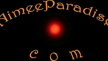 Purple-haired mature lady with big tits on webcam.