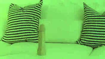 A beautiful naked teenager pleases herself with a sex toy
