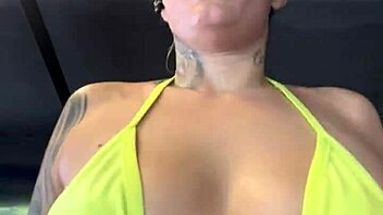 tanned babe in tiny bikini gets wet at Copacabana gym