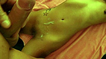 Tanned couple masturbates together, reaching orgasm with big cock cum