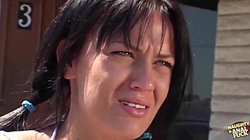 suburb girl with pigtails led inside for doggy on red couch