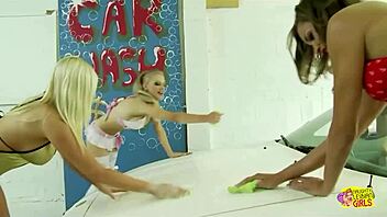 Girls rub big soapy tits on her car, making her horny for lesbian fun