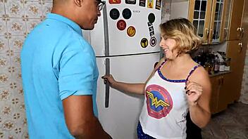 The slutty blonde takes a massive black cock deep in the kitchen for a wild pounding session.