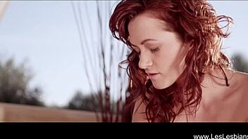 Beautiful lesbian lovers indulge in dildo play while bathing in the shower, their cute bodies glistening under the water