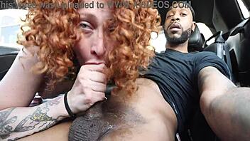 white girl subtly sucking in the car's front seat, deepthroating outdoors.