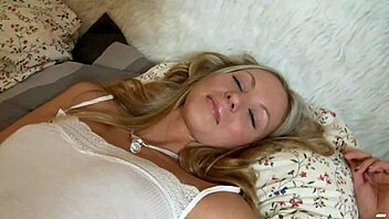 Is teen blonde Ksenya B teasing her wet pussy with purple vibrator?