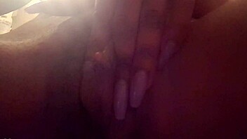 Pretty ebony woman masturbates solo