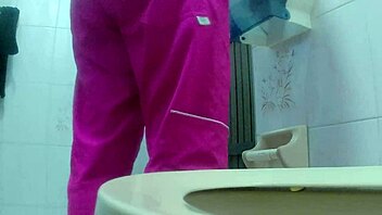 Amateur camera in the bathroom filming a hot nurse