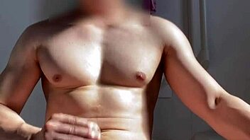 asian stud jerks off huge cock in bathroom after gym