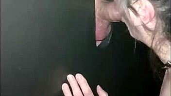 Female slave gives blowjob at gloryhole, swallows cum 😈